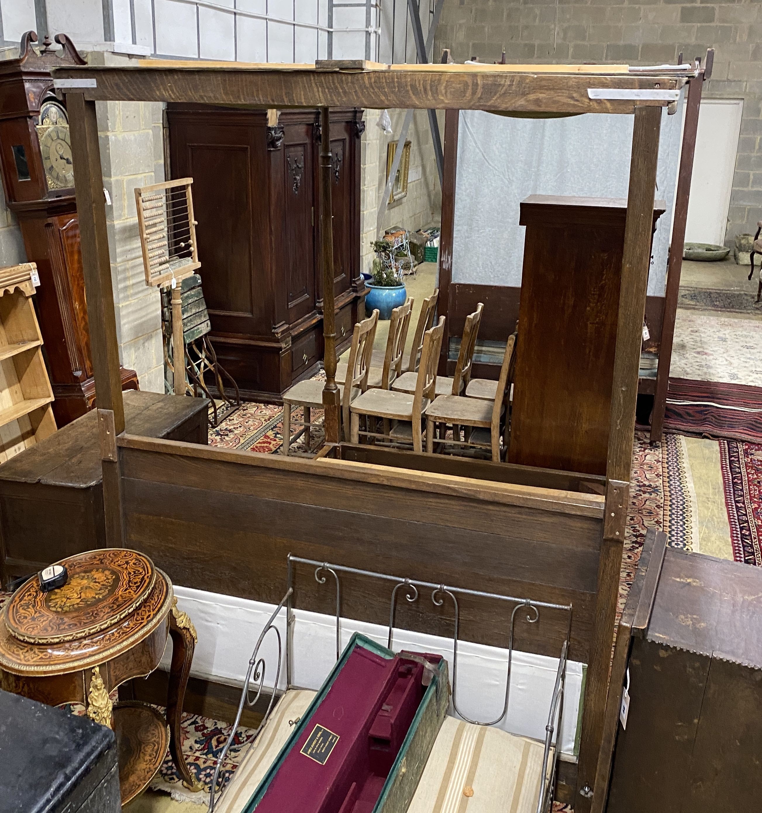 A George III style oak four poster bed frame, with drapes, length 205cm, width 152cm